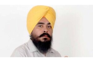 Former politician walks away from a government building while media personnel and cameras gather outside during a high-profile investigation in Punjab.