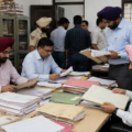 Officials examine financial documents, tenders, and project records related to civic development works carried out over the past few years.