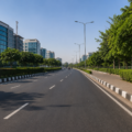 Gurugram Sector 51-52 service road upgrade project showing a modern urban road with greenery and improved infrastructure