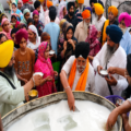 Sikh devotees participating in Chabeel Seva and distributing sweetened cold water on the martyrdom day of Guru Arjan Dev Ji.