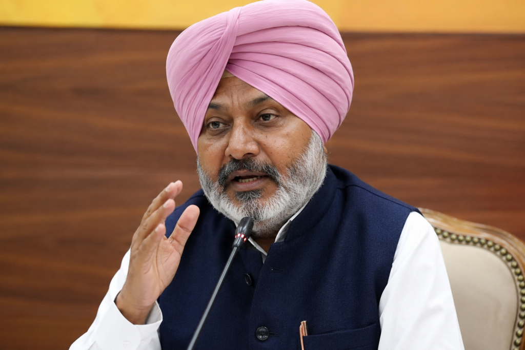 Punjab Finance Minister Harpal Singh Cheema addresses a press conference while responding to political allegations against Chief Minister Bhagwant Mann.