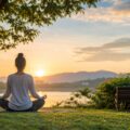 A calm outdoor scene with a person relaxing in nature, symbolizing mental peace and emotional well-being.