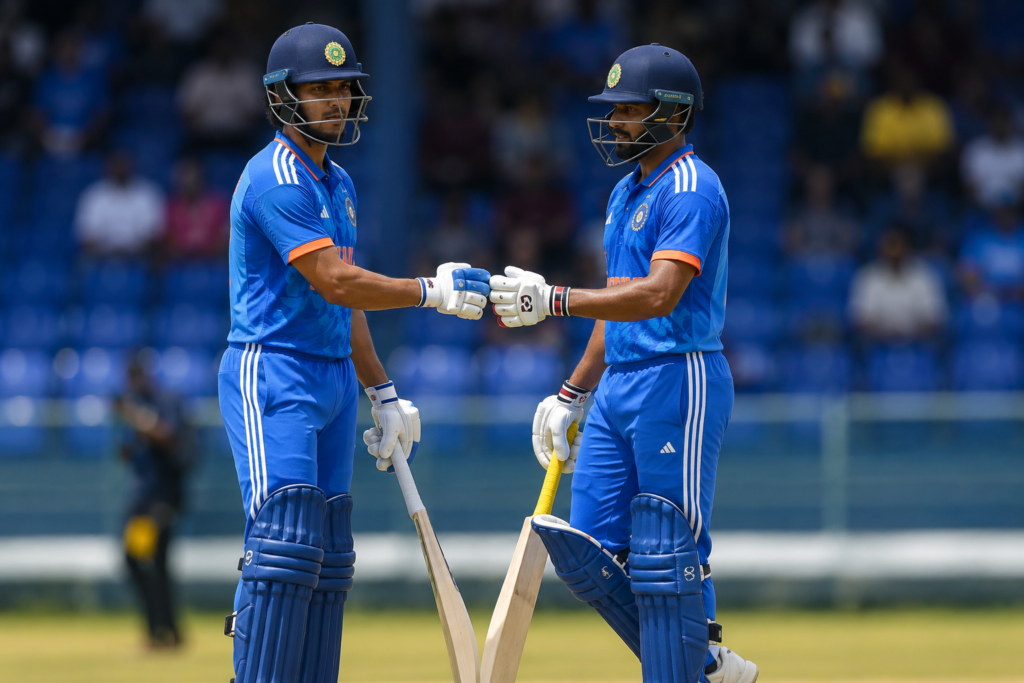tilal varma An Indian batter plays a controlled shot during a professional cricket match as teammates watch from the dressing room. The scene highlights India A's fightback against Afghanistan A in the Tri-Nation Series 2026. Image Title