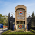 Kurukshetra University entrance gate in Haryana with its main building and landscaped campus surroundings