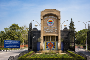 Kurukshetra University entrance gate in Haryana with its main building and landscaped campus surroundings